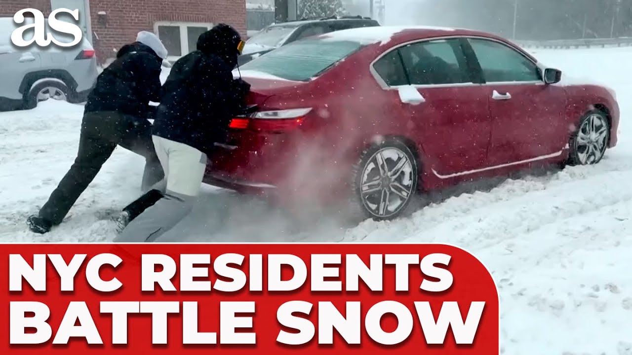FULL FOOTAGE: NEW YORKERS cope with HEAVY SNOWFALL and battle slippery streets as STORM blankets USA
