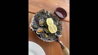 Must-try food in Madeira - Lapas or Limpets in Madalena do Mar, Madeira, Portugal.