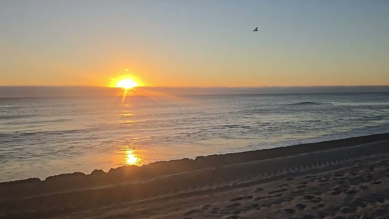 Sunrise cold morning Florida chill ocean waves calming