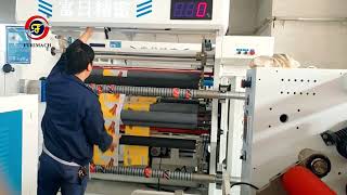 Auxiliary paper core positioning system for slitting machine