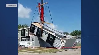 Modular home snaps while being dropped by crane