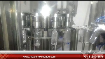 AUTOMATIC 3 IN 1 ROTARY BOTTLE RISING FILLING CAPPING MACHINE - MAX ION EXCHANGE
