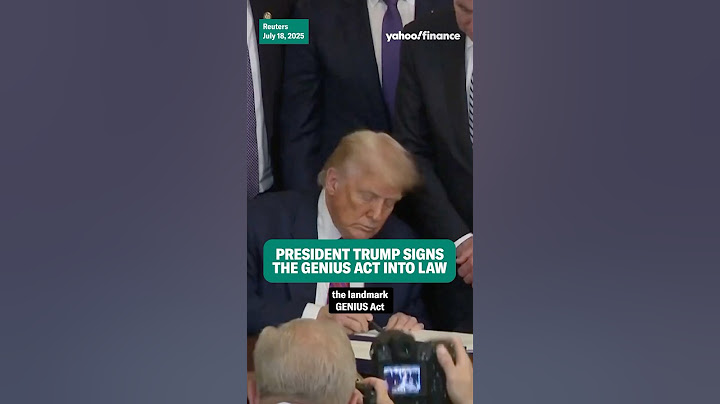 President Trump signs the GENIUS Act into law.