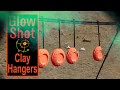 Glow shot clay target hangers