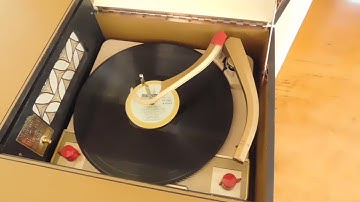 Voice of Music Hi-Fi record player playing an LP record.