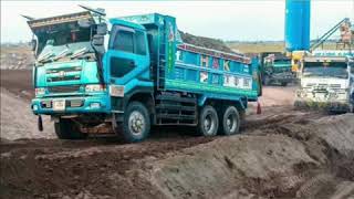 Nissan diesel/ UD V8 decorated dump trucks in Pakistan with huge loaded sand and soil