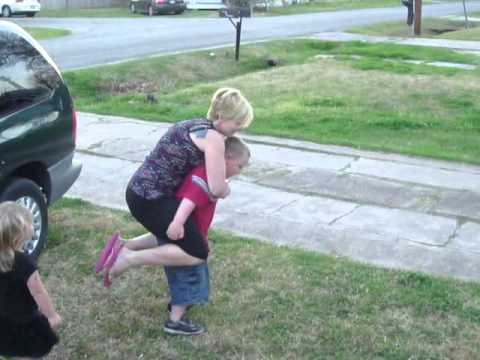 Son gives mom piggy back rides!