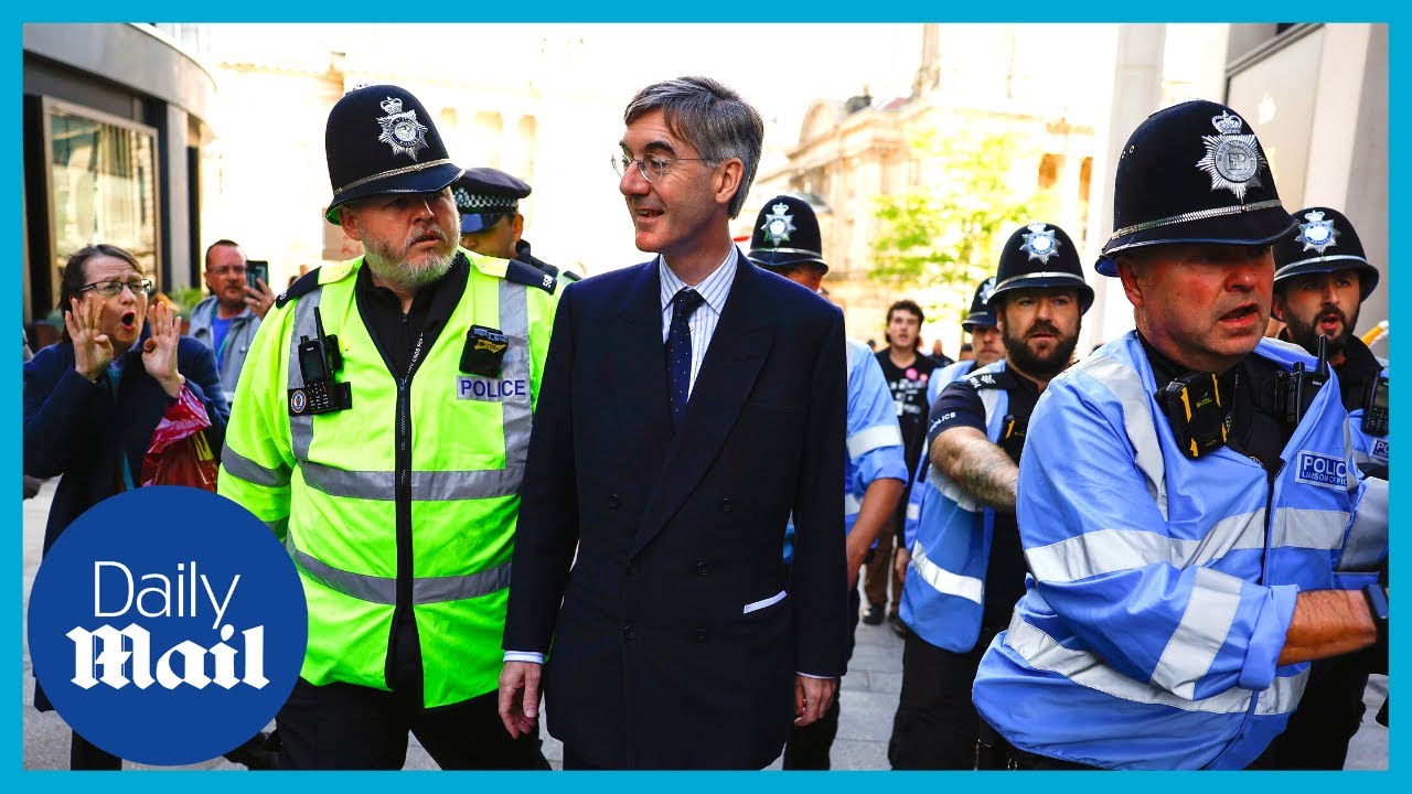 Police escort Jacob Rees-Mogg as swarm of hecklers chant ‘Tory scum’