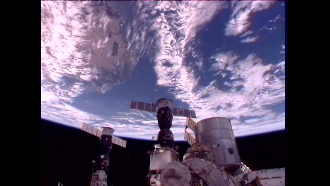 Russian Cosmonaut Captures Satellite Passing Space Station