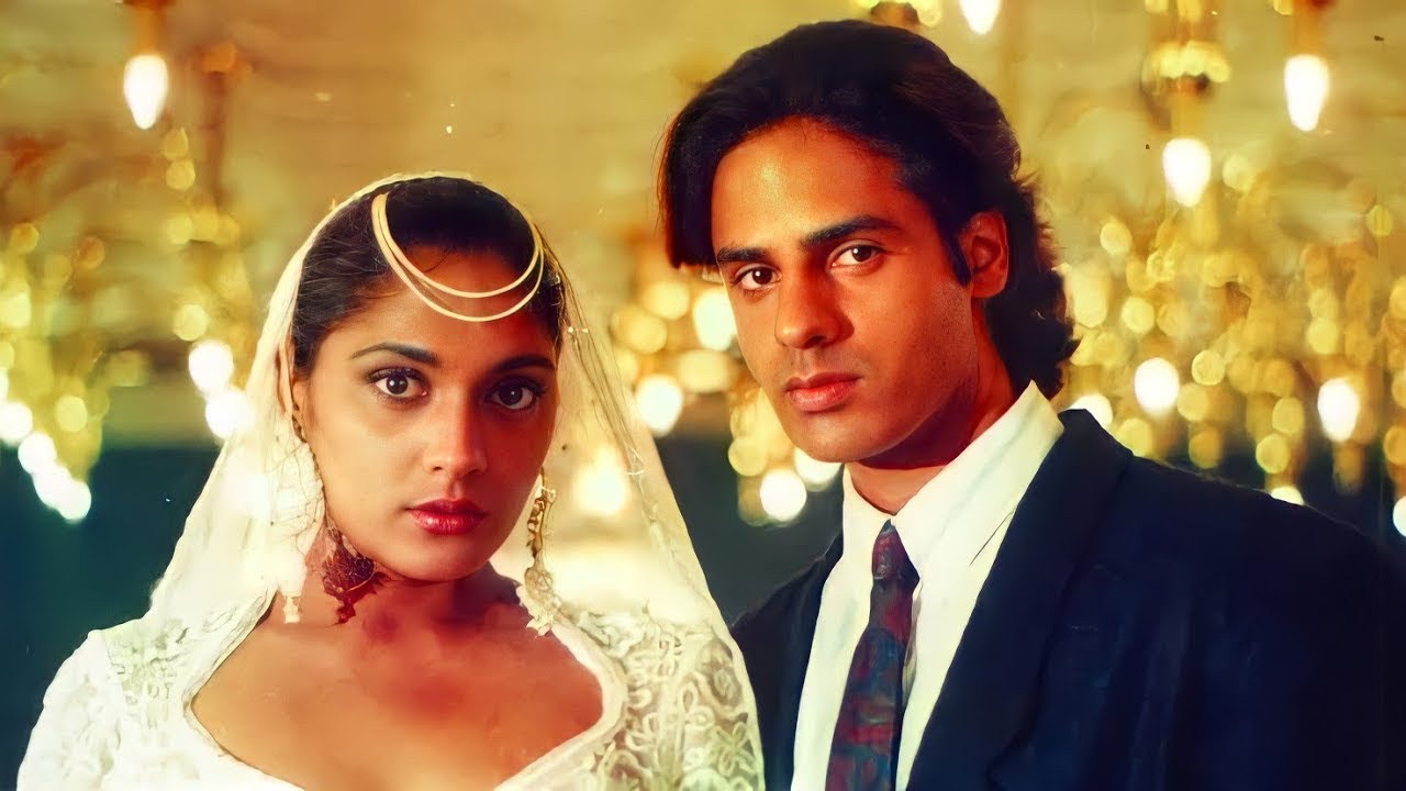 Songs and music : Still from Aashiqui ( Song- Dheere Dheere Se) featuring its lead characters in a romantic scene.