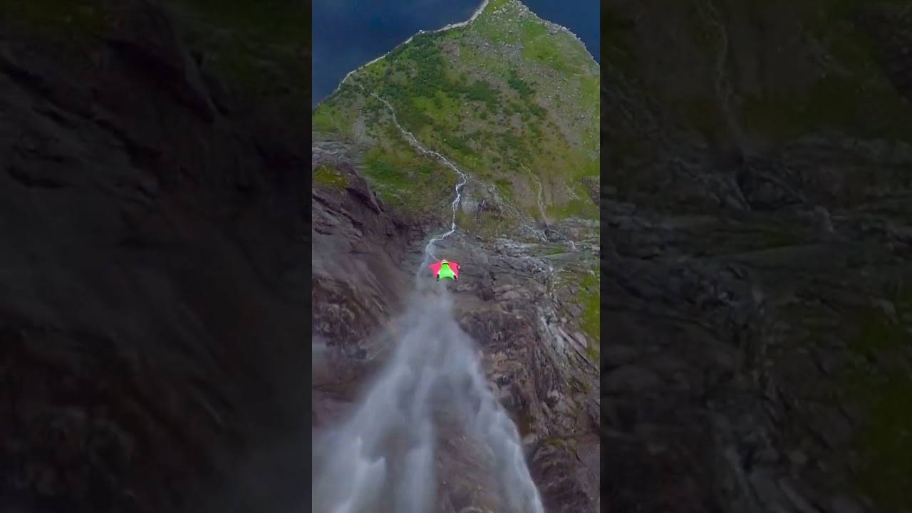Wingsuit BASE-jumping over waterfalls in Norway #extremesports #worldtravel #norway
