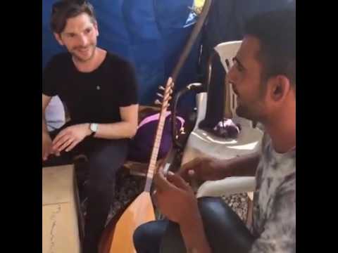 Editors' drumming session with Filippiada camp resident Barzani in Greece