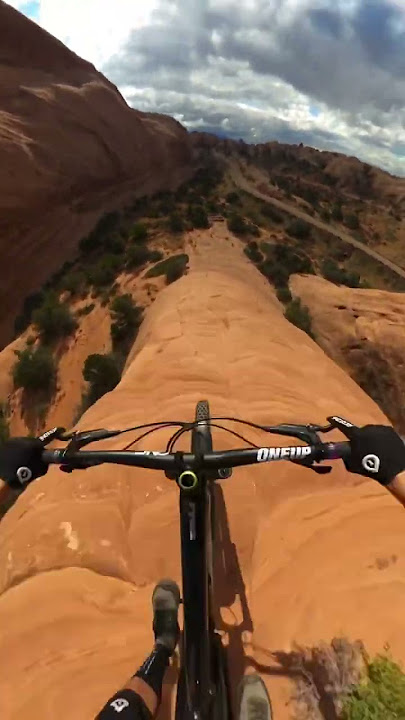 MTBer rides down a cliff with no climbing gear