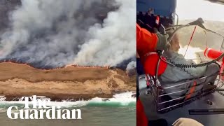 Stranded boater rescued from wildfire burning on California island