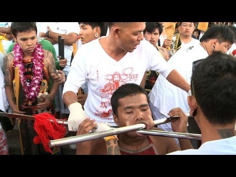 Extreme piercing for purity in Thai vegetarian festival