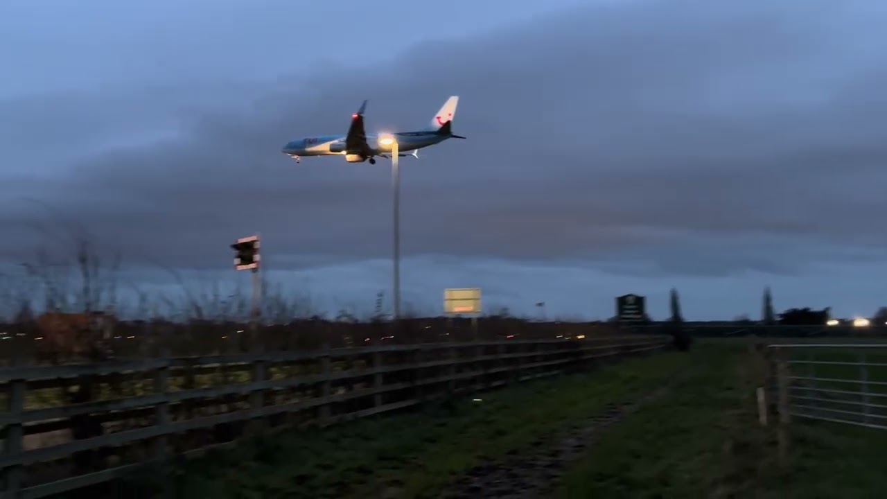 TUI plane goes over and lands in Bournemouth airport 