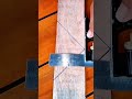 Wood plank measured, grain lines guide precise cut
