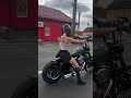 Lady cruising on Harley .