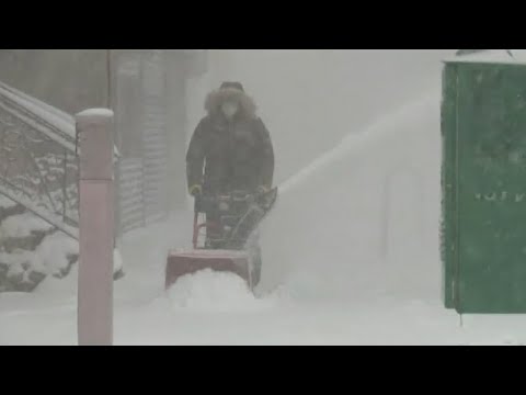 New York battered by high winds, blanketed in heavy snow from winter nor'easter