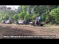 Works officials drive on Alotau to Port Moresby track