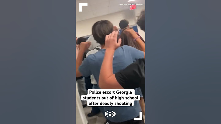 Police escort Georgia students out of high school after deadly shooting