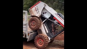 loading bobcat into a trailer