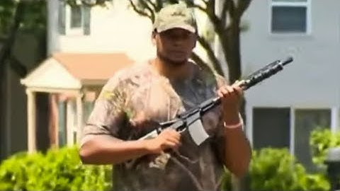 Man Walks Around School Bus Stop Carrying Assault Weapon in Protest of Gun Laws