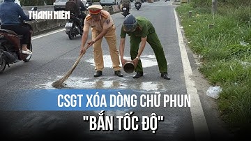 CSGT TP.HCM xóa dòng chữ "bắn tốc độ" phun trên mặt đường Lê Quang Đạo