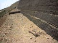 Examining the outside of reinforced embankment...