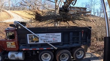 Cat 309cr Excavator And Mack Tri-axle Dump Truck loading Nasty debris off job site
