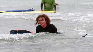 Film star Helena Bonham Carter riding the crest of a wave as she tries surfing in Cornwall hideaway