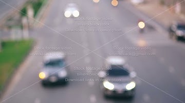 Colorful traffic lights bokeh circles on night city street. Abstract background