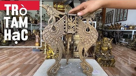 Trò đồng tam hạc _ Phật di lạc cữi cá chép bằng đồng.