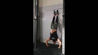 Eccentric Kipping Handstand Push Up