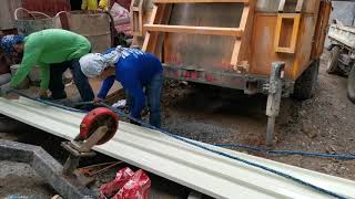 Manual Lifting of Roofing Sheets