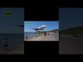 INSANE: Low-flying plane nearly clips tourists during beach landing in Greece