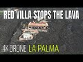 La Palma: Red Villa stops the lava in the middle of lava fields! 4K Drone 60 fps 04.12.21