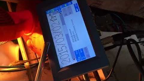 industrial inkjet printer coding date and characters on food packaging bags in assembly line