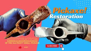 Restoration of the old rusty small pickaxe