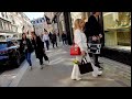 Street fashion in London. Nice street style. Walks  city.