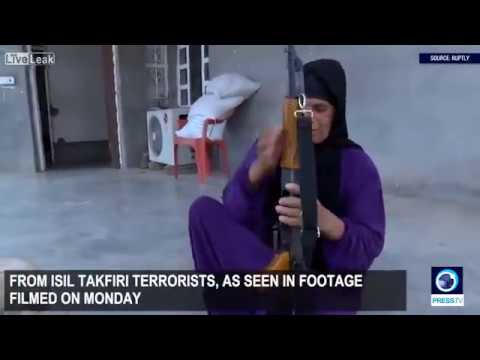 شاهد امراة عراقية تحمل السلاح للدفاع عن قريتها ضد داعش