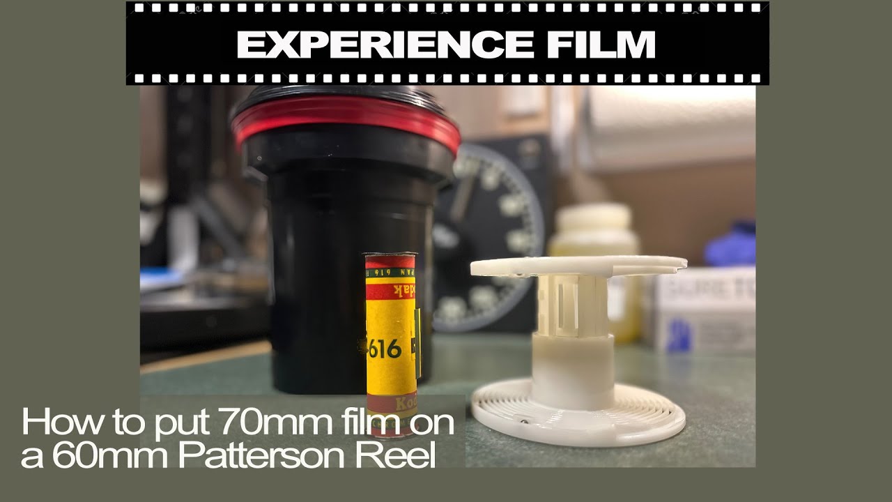 How do you load 70mm film onto a 60mm developing reel 