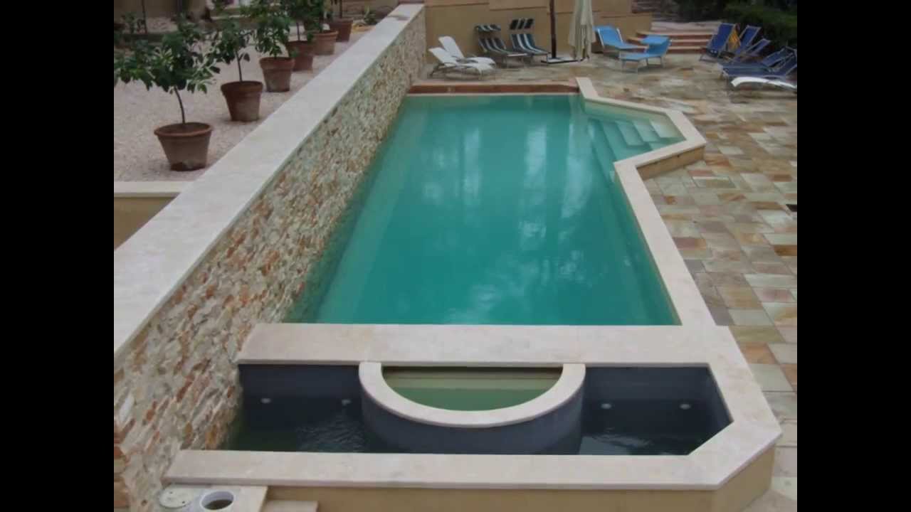 Piscina a bordo sfioro, con vasca idromassaggio e nuoto ... Nuoto controcorrente per piscine fuori terra