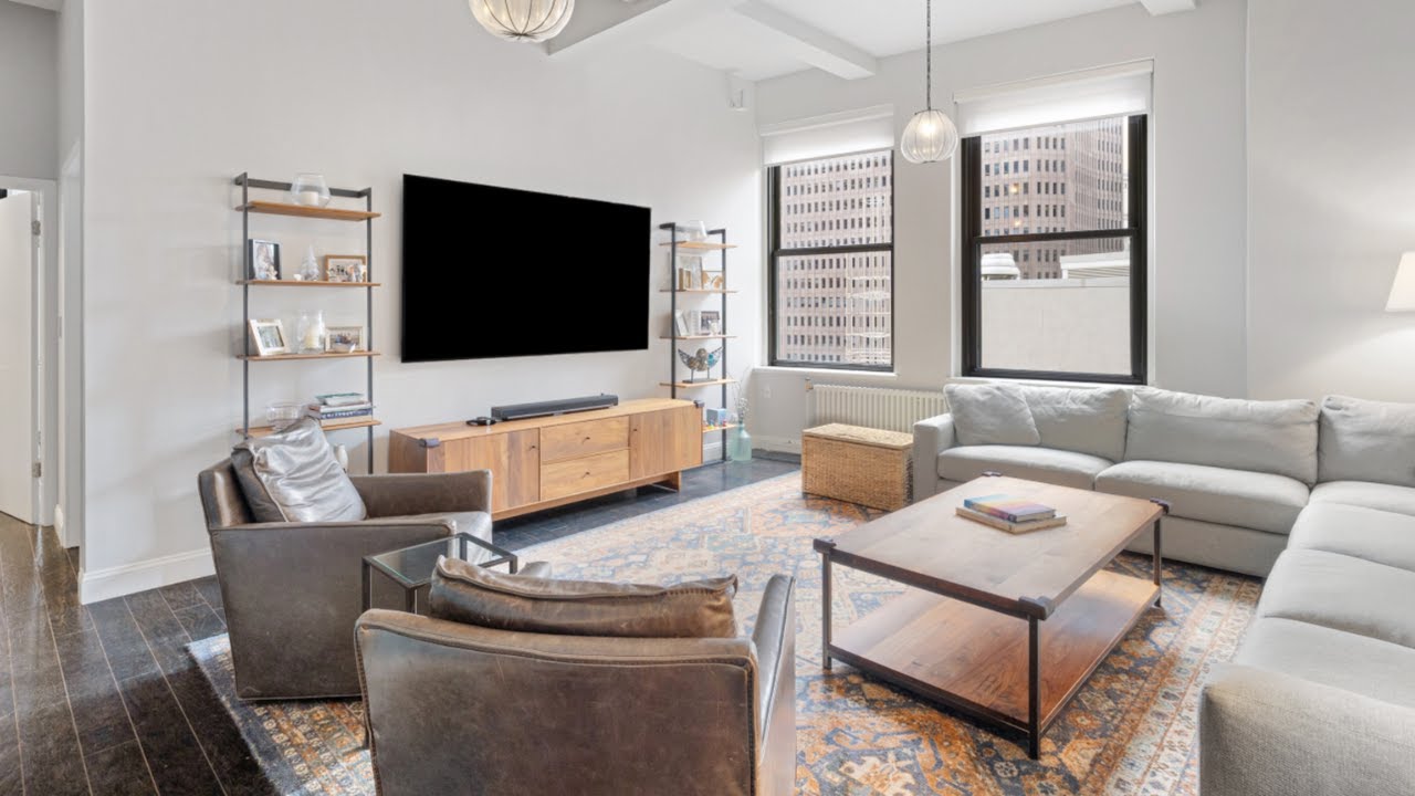 TOURING a Stunning Loft-Style 2-Bedroom in Prime Financial District New York City | SERHANT. Tour