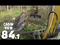 A wide beaver dam with a mass of branches and mud  beaver dam removal with excavator no841