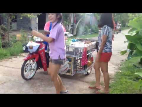 Thai girls funny dance with street foods entertainment.