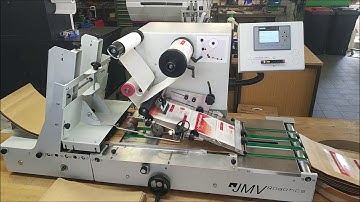 Automatic labelling of large paper pouches with large labels – LAB510