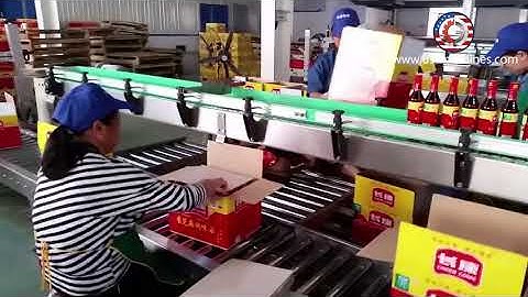 Manual loading bottle into carton box packing machine with conveyor platform