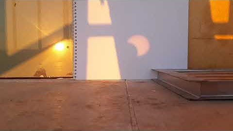 Watching partial solar eclipse using binocular projector Timelapse HD Royalty free stock footage