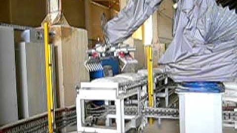 Fuji-Ace Robot Palletiser Stacks Phosphate Bags For Sea Freight.